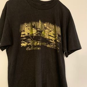Vintage Yellowstone t-shirt in black with shiny gold screen print. Size large.